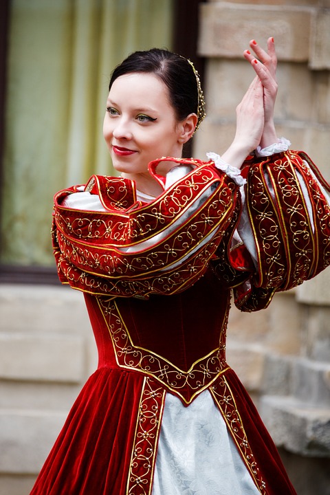 Woman in Medieval dress clapping