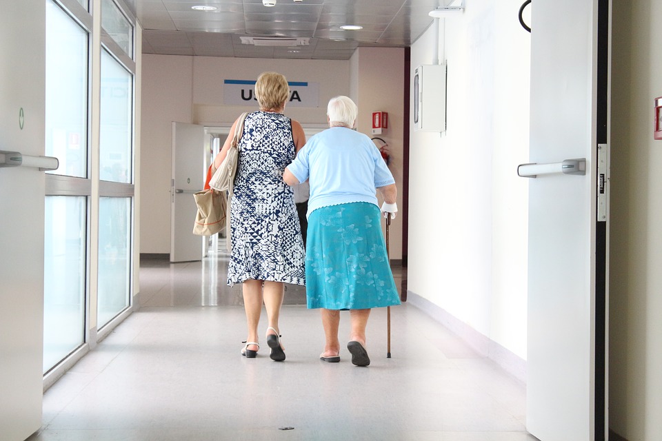 Women walking in hospital corridor