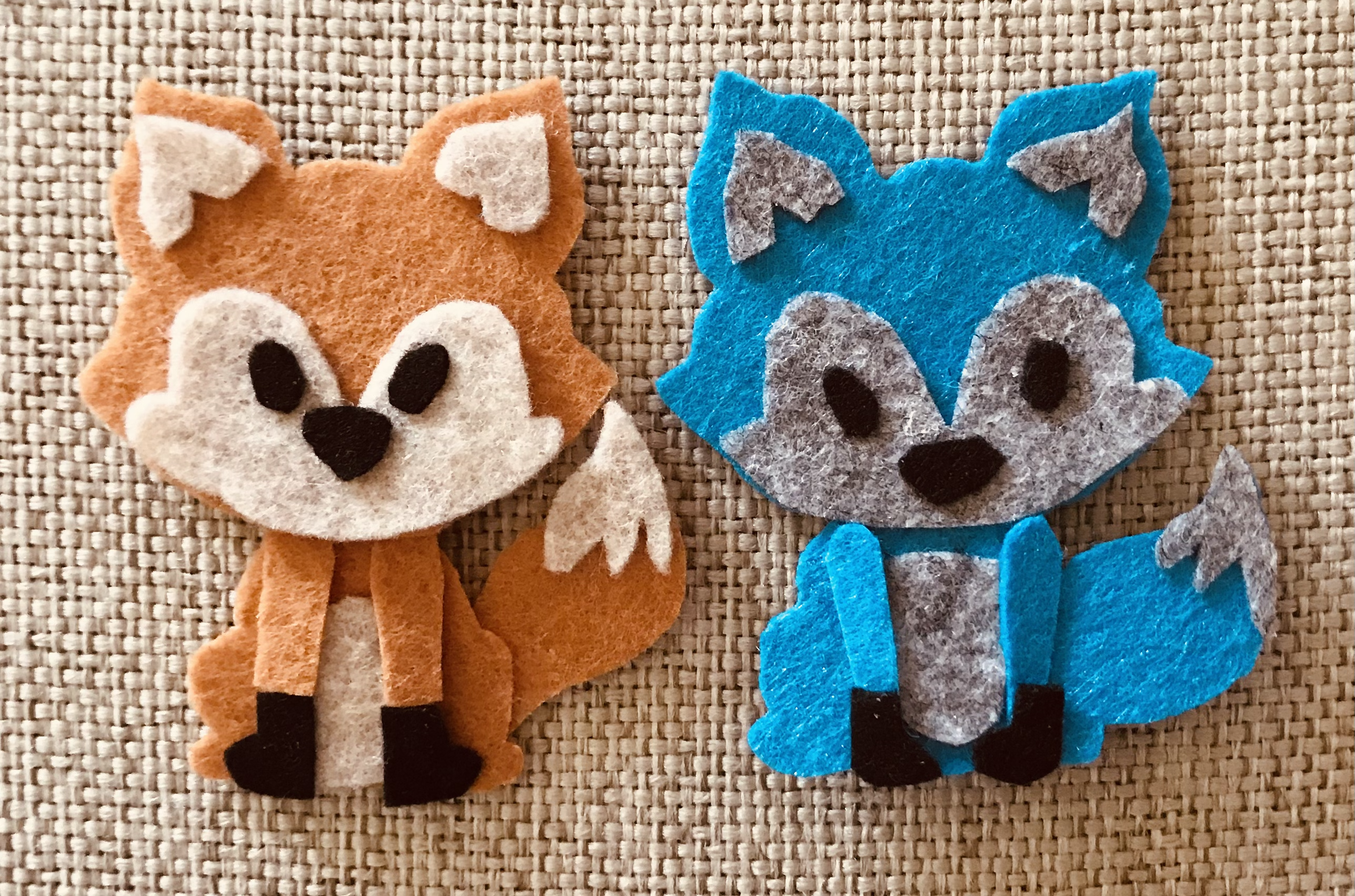 two felt foxes